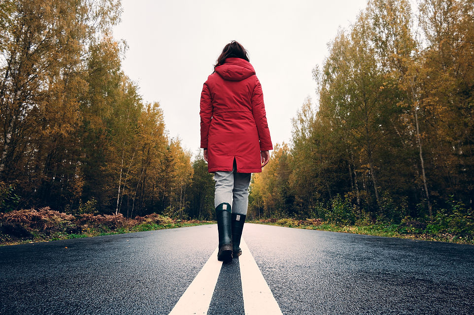 woman-rubber-boots-walks-along-white-line.jpg